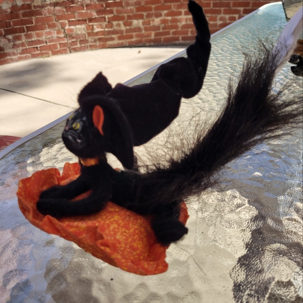 AnnaLee 8" Halloween Black Cat Sitting On Orange Glittery Cushion.